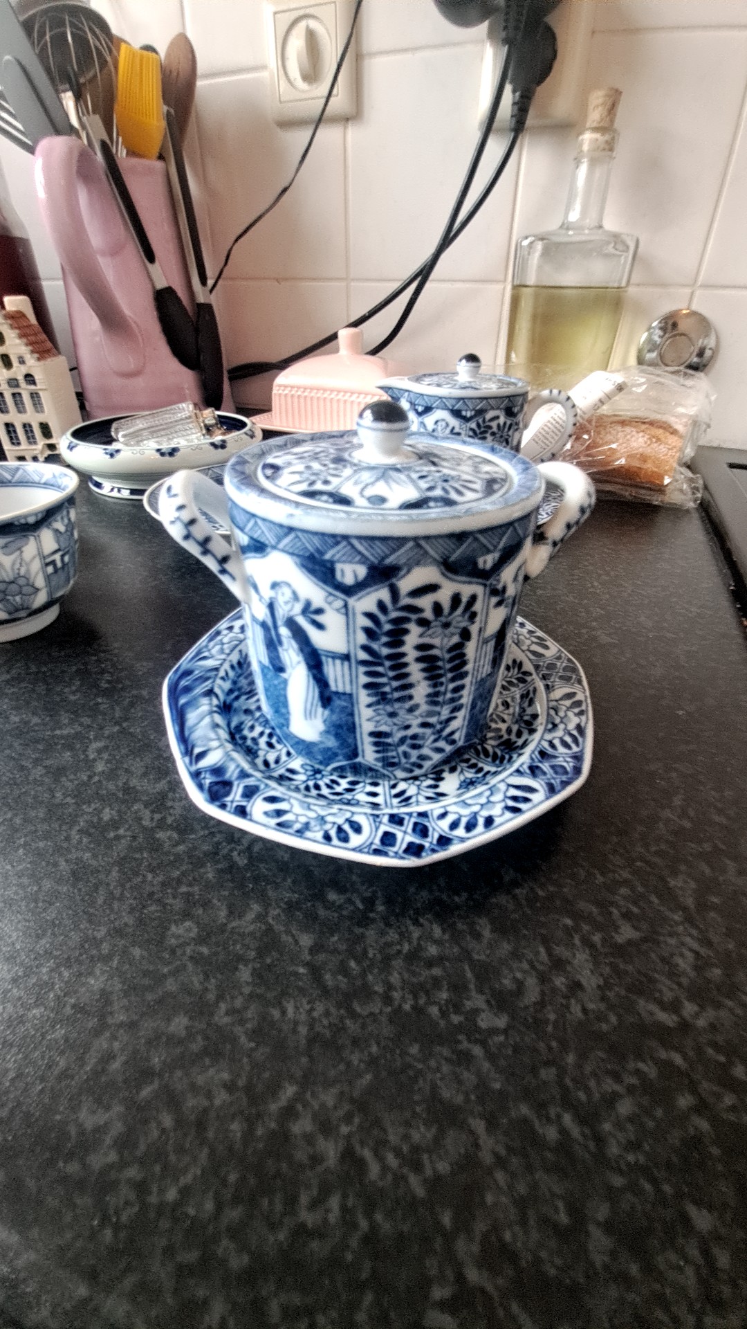 Japanese Arita Blue and White 'Long Eliza' Lidded Cup and Saucer - view 1
