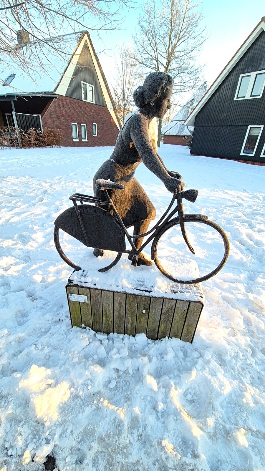 Figurative Sculpture of Woman on Bicycle - view 2