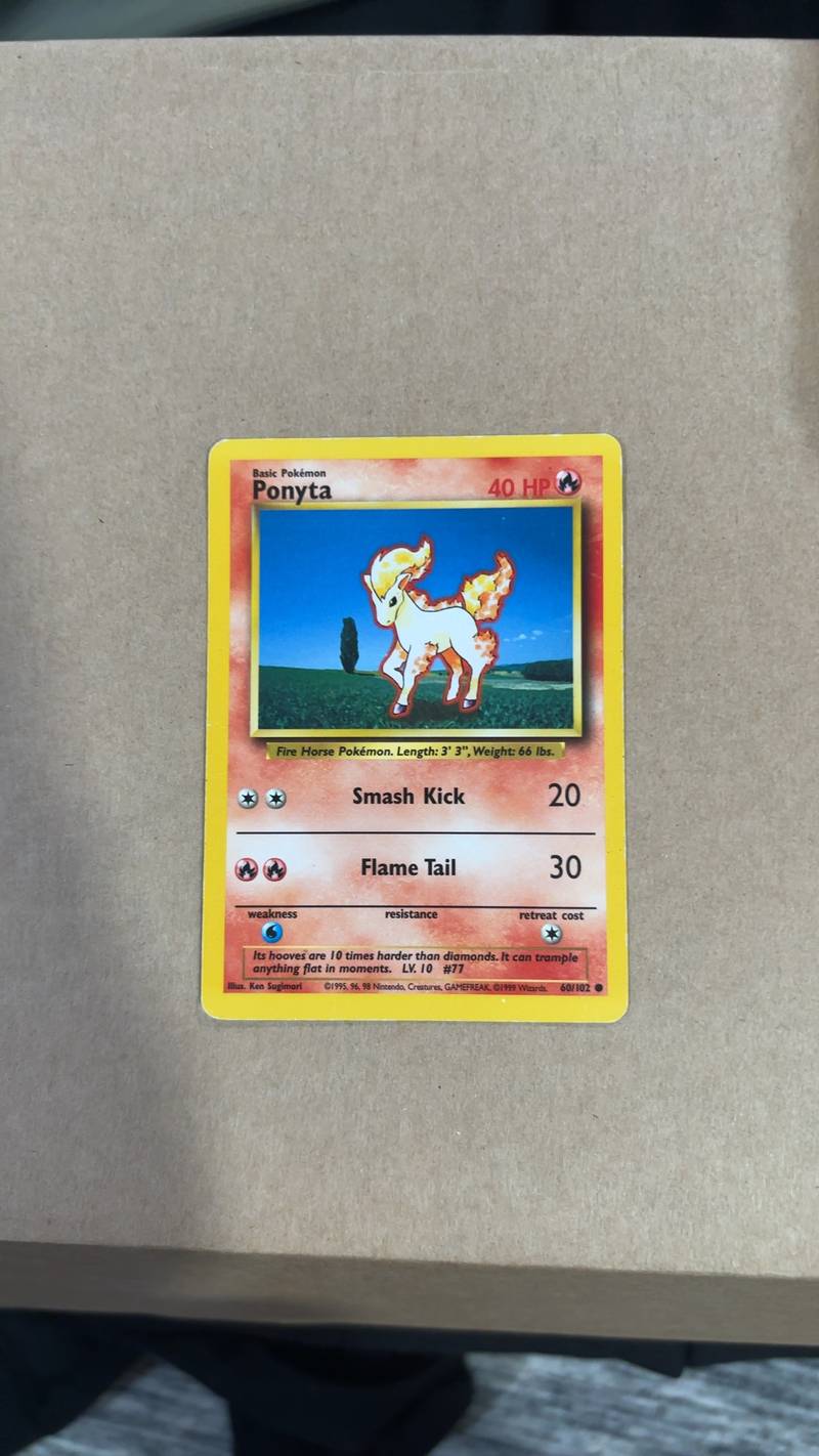A 1999 Pokémon Base Set Ponyta trading card, number 60/102, in Unlimited English edition showing minor edge wear. - view 1