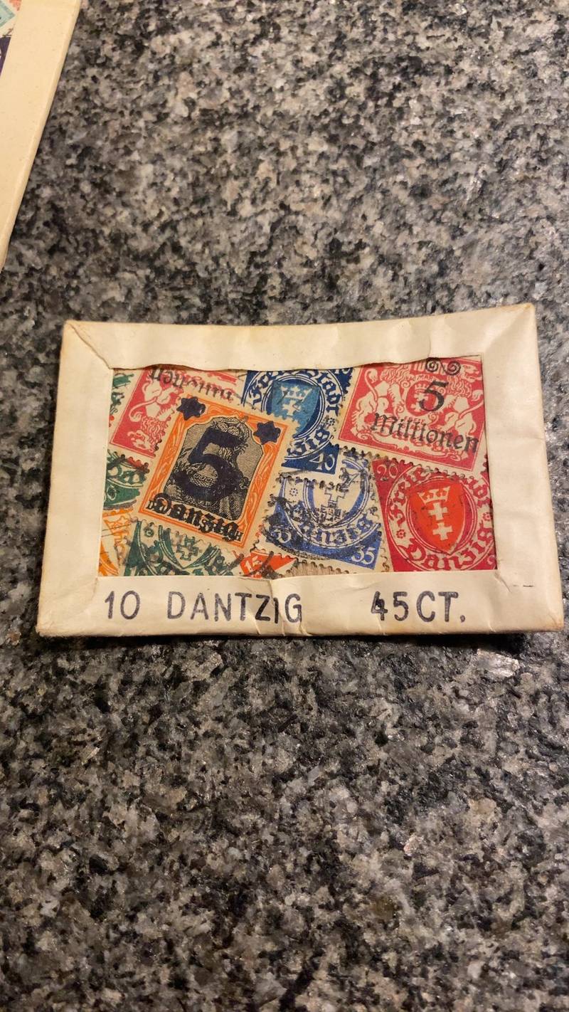 A paper-framed collector's packet containing 10 vintage stamps from the Free City of Danzig, labeled 45 cents, showing various denominations.