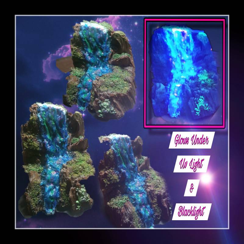 Dash Rodgerz diorama waterfall sculpture shown under ambient lighting and glowing cyan under blacklight UV illumination