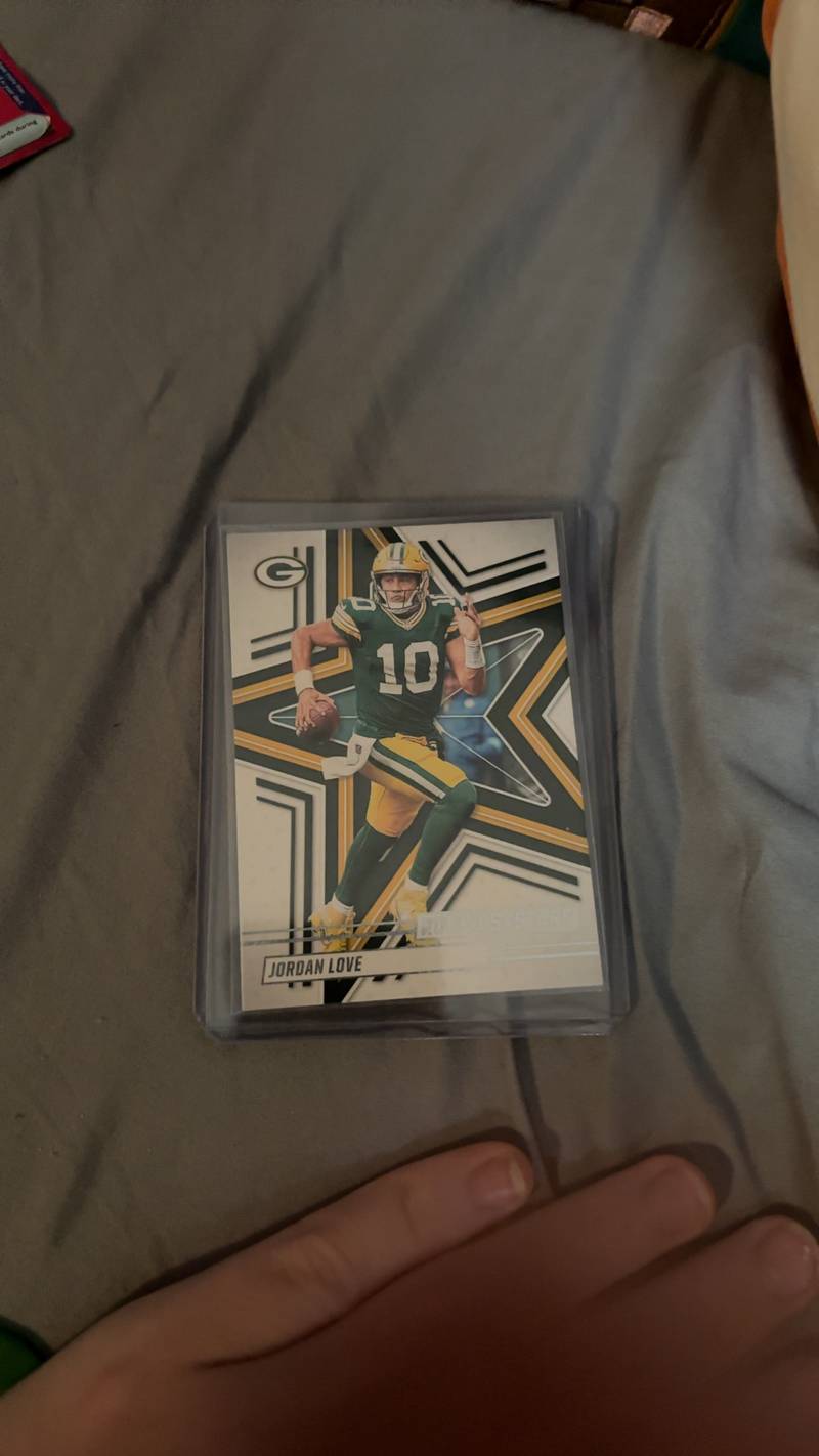 Front and back of a 2025 Panini Rookies & Stars Jordan Love football card number 71 in a protective top-loader. - view 1