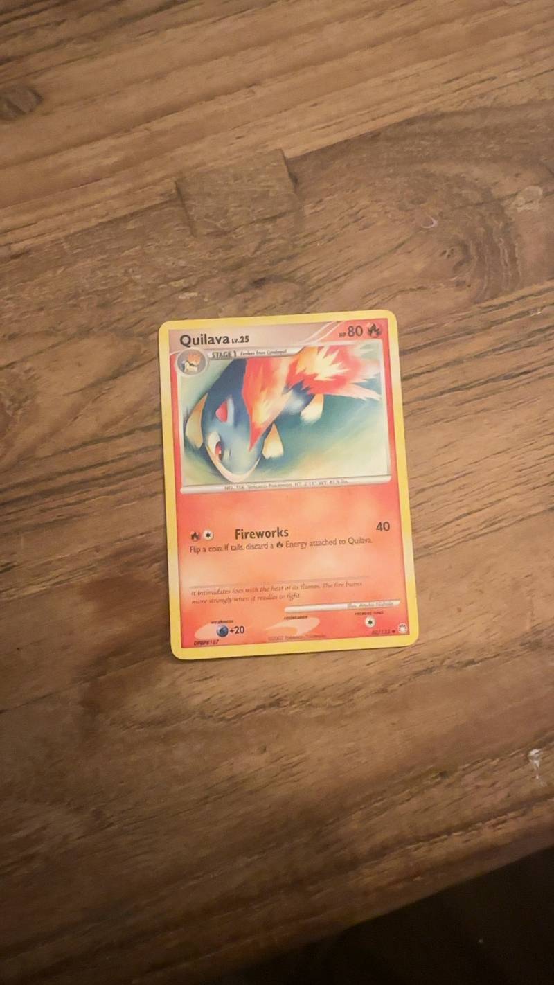 Pokémon TCG Quilava Lv.25 card from the Mysterious Treasures set, featuring a fiery artwork on a wooden background.
