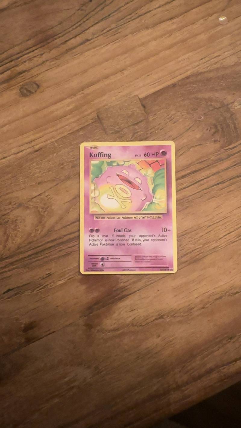 A Koffing Pokémon trading card from the Evolutions set, showing the Poison-type Pokémon and its Foul Gas attack.
