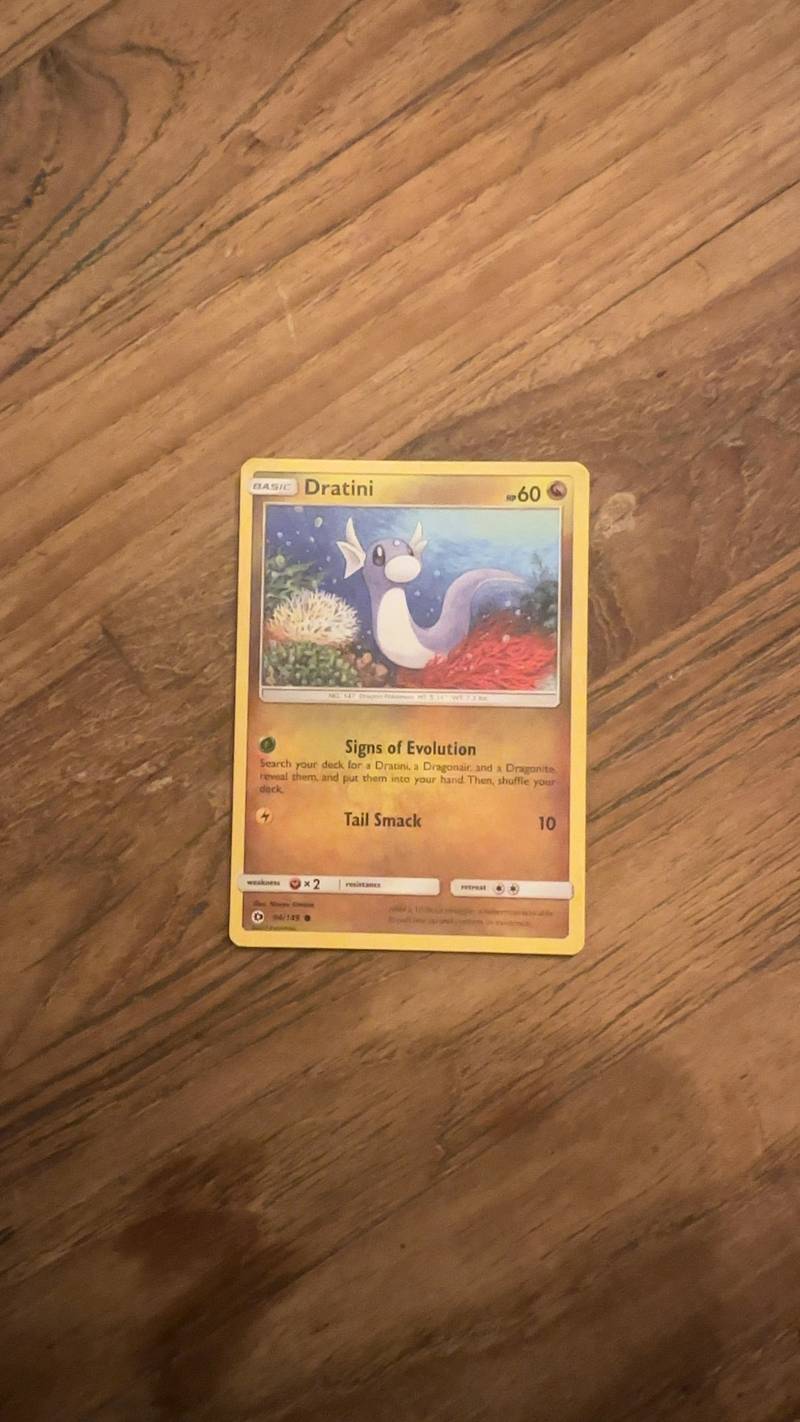 Pokémon TCG Dratini Basic card from the Sun & Moon set, featuring Dratini in an underwater artwork.
