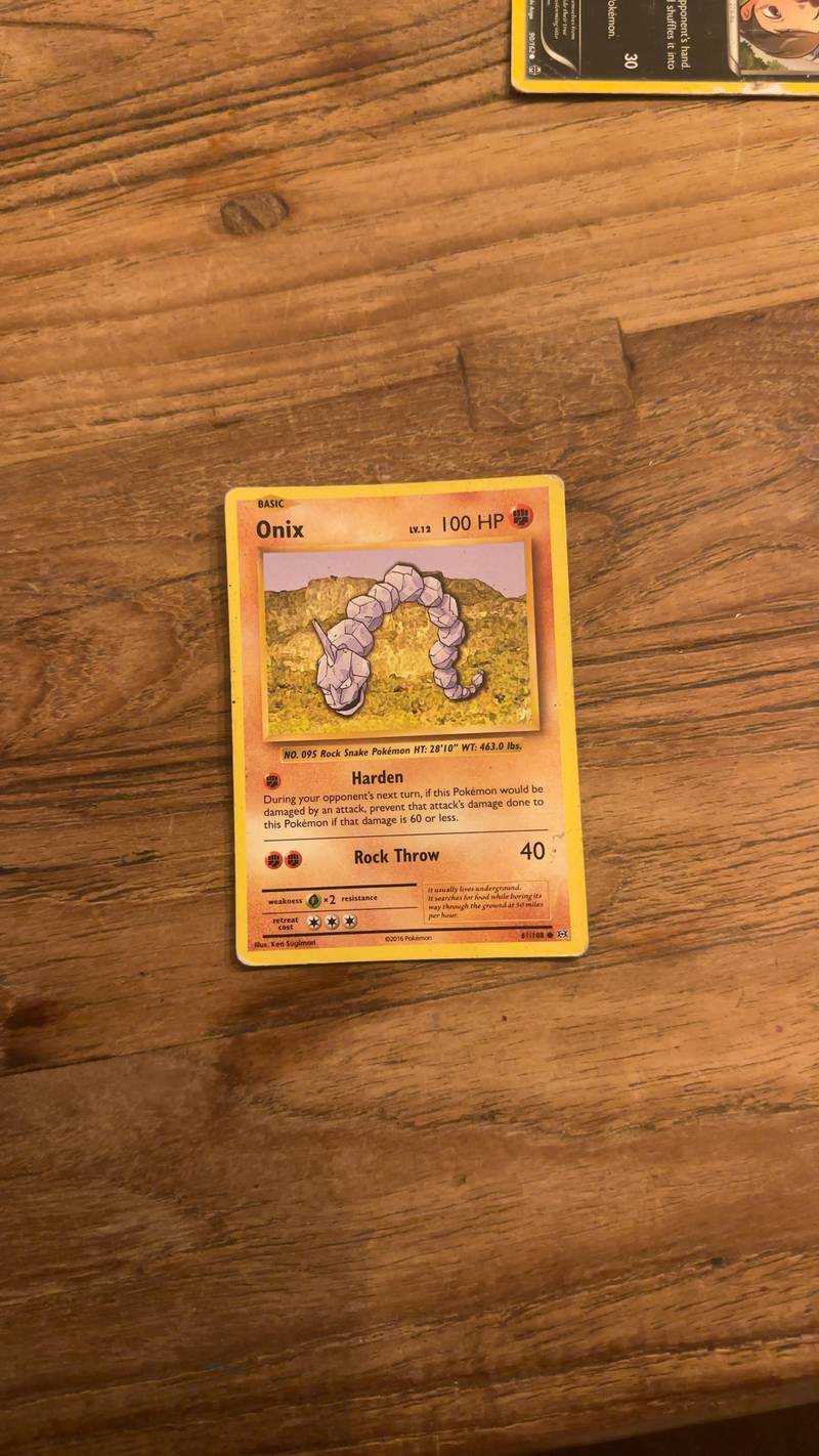 English Pokémon TCG Onix card (61/108) from the XY Evolutions set, showing minor edge wear.