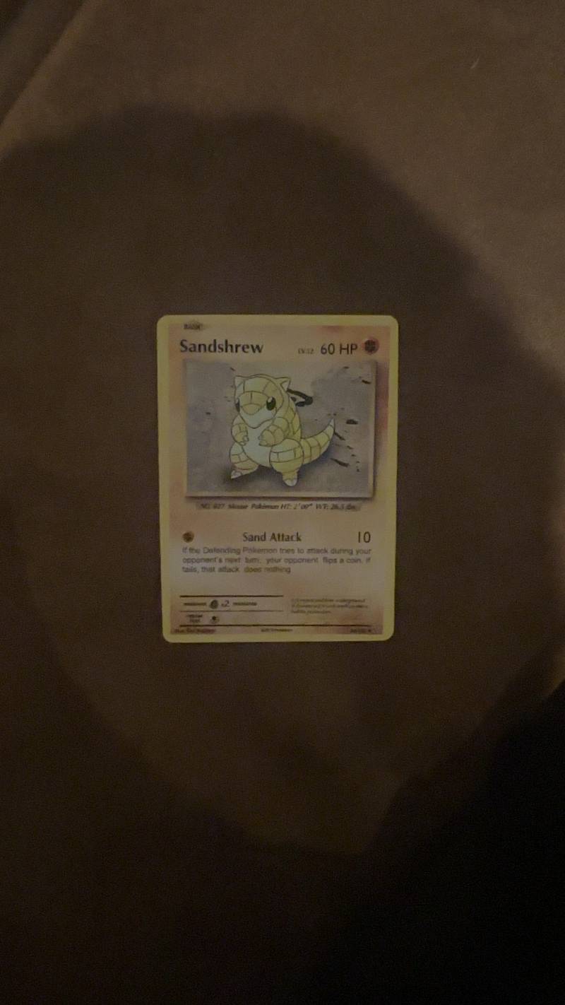 A close-up shot of a vintage Pokémon Sandshrew card from the Base Set. - view 1