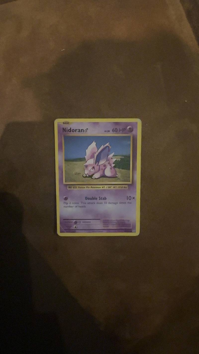 English Pokémon TCG Nidoran♀ Base Set card, showing the purple Pokémon in a grassy area, Basic type, 60 HP.