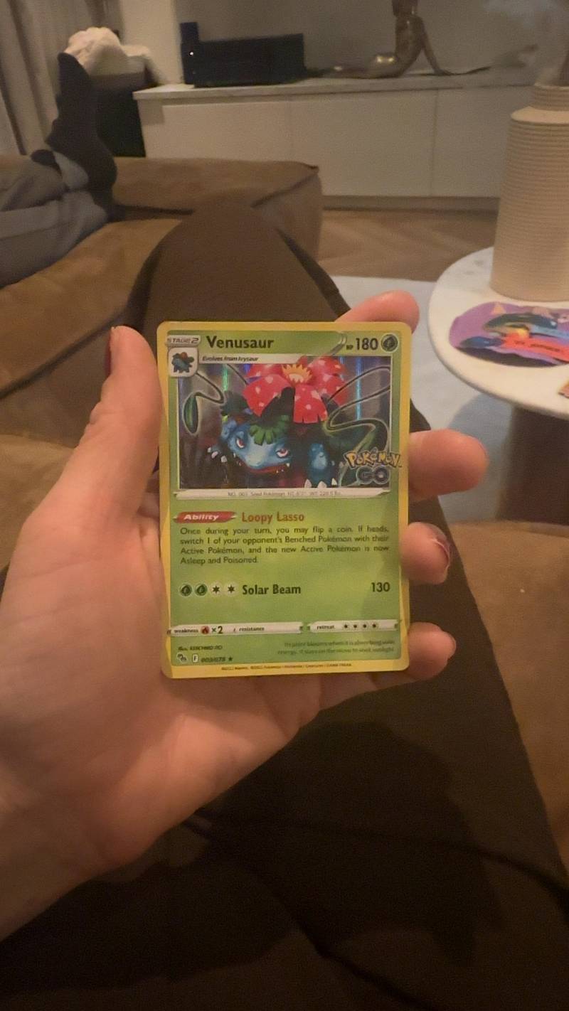 Venusaur Holo Rare Pokemon GO Trading Card [003/078] in front of a person's hand.