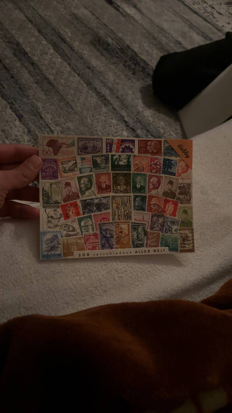 A commercial hobby packet of 200 different worldwide postage stamps featuring various mid-20th-century issues from Europe and Asia. - view 1