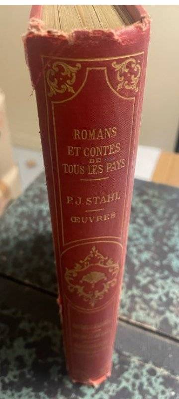 Spine, title page, and red gilt cartonnage cover of Hetzel edition Romans et Contes by P.J. Stahl. - view 1