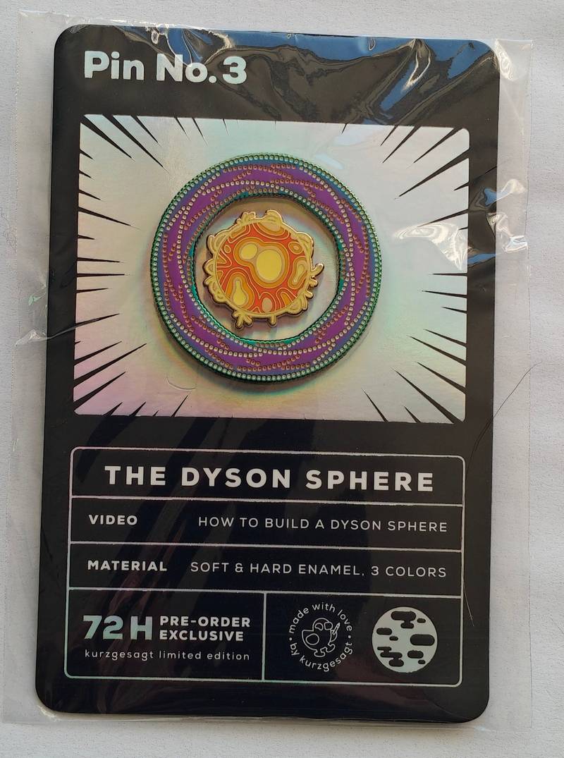 Kurzgesagt Dyson Sphere pin on a black and holographic backer card, labeled Pin No. 3 and 72H Pre-order Exclusive.