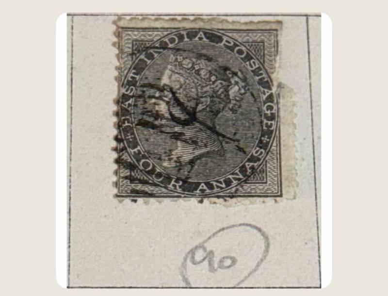 Close-up of 19th-century British India postage stamps and embossed postal stationery cut-squares - view 1