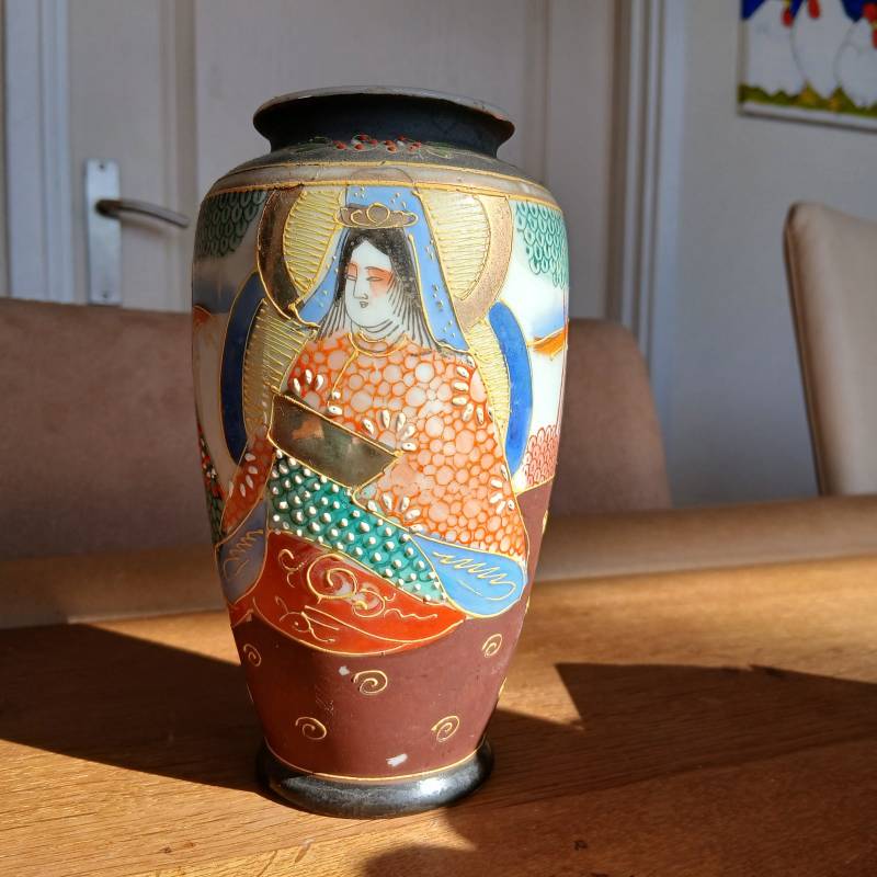 Japanese Satsuma-style porcelain vase with raised moriage decoration of a Buddhist figure and a red bird mark on the base. - view 1