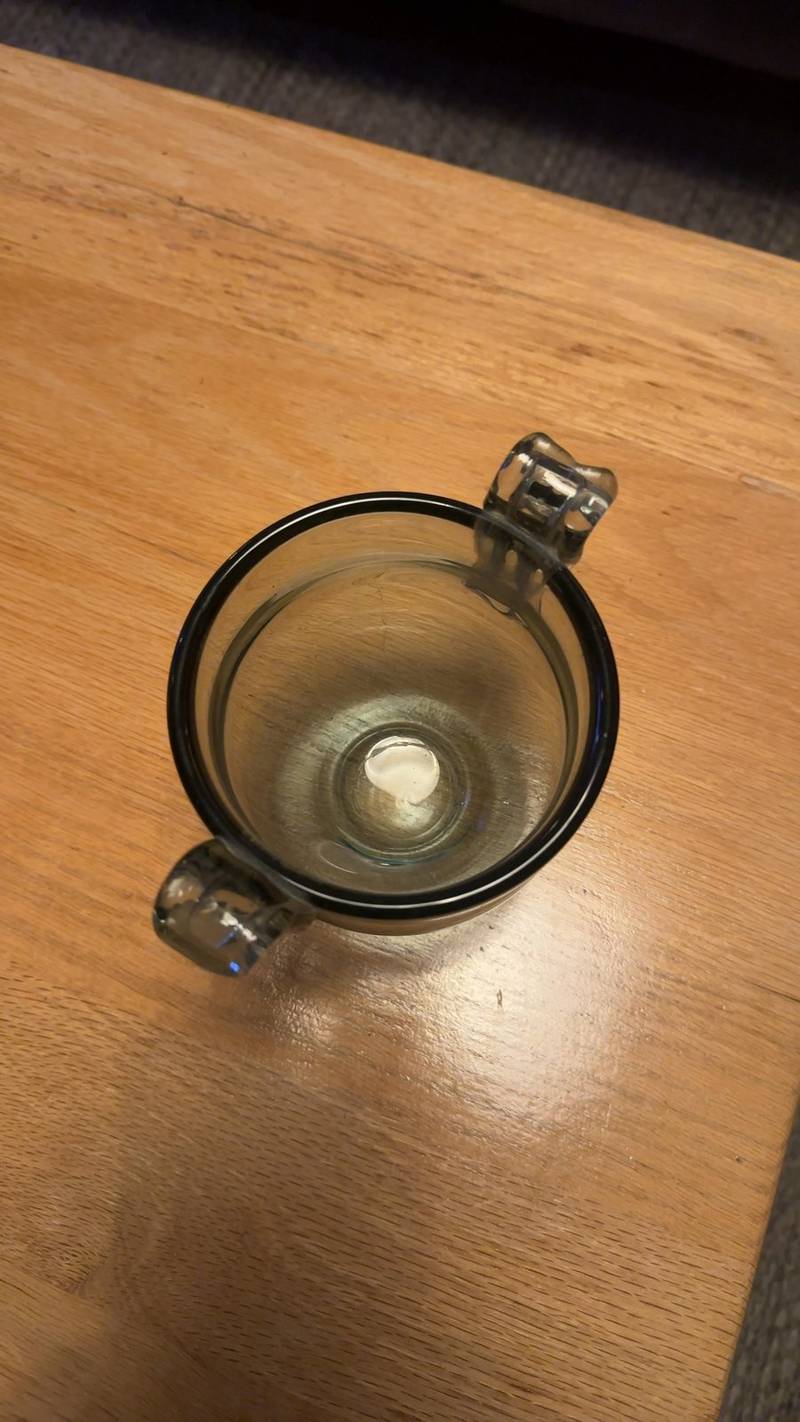 Iittala Kimara smoke glass bowl with two clear handles, featuring a sandblasted 'i' logo on the base. - view 1