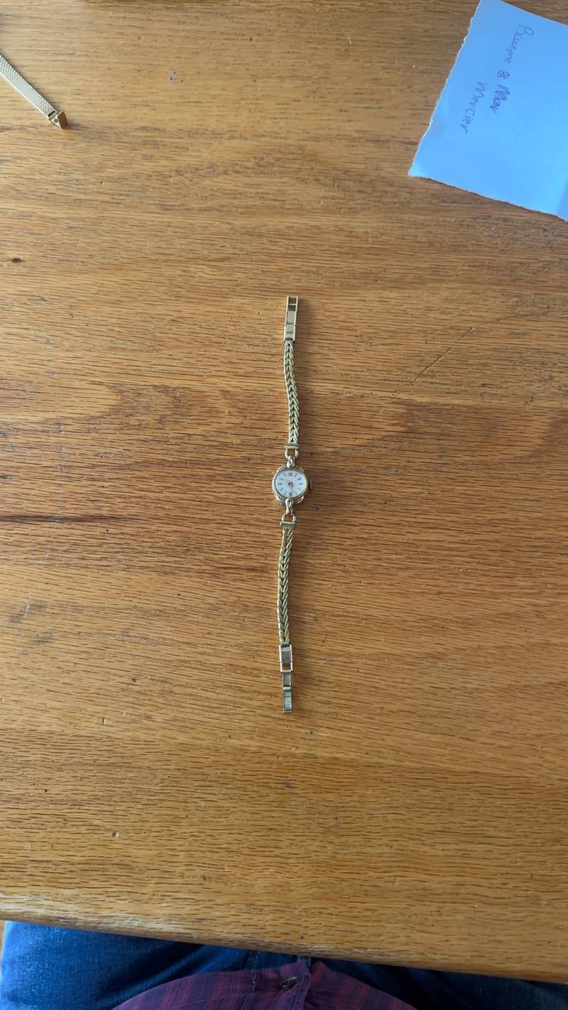 Vintage Roamer ladies cocktail watch with 20 micron rolled gold case and braided wheat-link bracelet on a wooden surface. - view 1