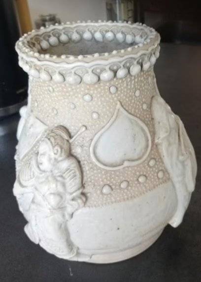 Chinese white-glazed stoneware vase with high-relief figures of immortals and a stippled background, late Qing Dynasty. - view 1