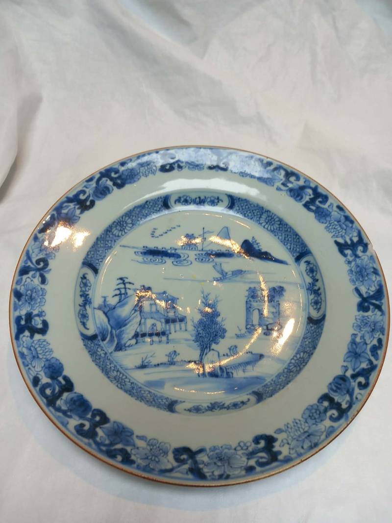 Late 18th-century Chinese export blue and white porcelain plate with river landscape and floral border. - view 1
