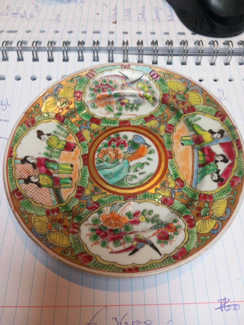 19th-century Chinese Rose Medallion porcelain saucer with four panels of figures and flowers surrounding a central bird and flower medallion. - view 1