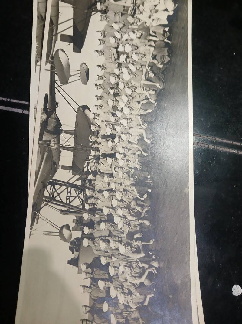 Vintage gelatin silver photograph of US Navy sailors posed on deck before a catapult floatplane