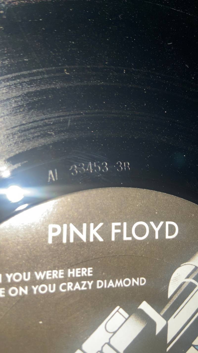 Close-up of Pink Floyd Wish You Were Here vinyl record label and stamped dead wax matrix AL 33453-3B - view 1