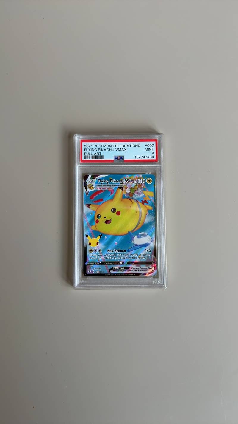 PSA 9 Graded Flying Pikachu VMAX Celebrations card 007/025 showing Pikachu with balloons. - view 1