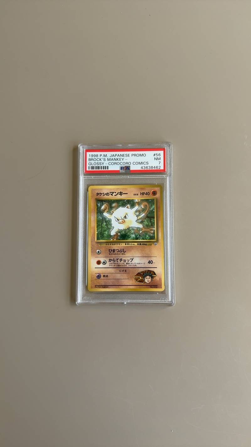 PSA 7 graded 1998 Japanese Pokemon Brock's Mankey Glossy CoroCoro Promo trading card. - view 1
