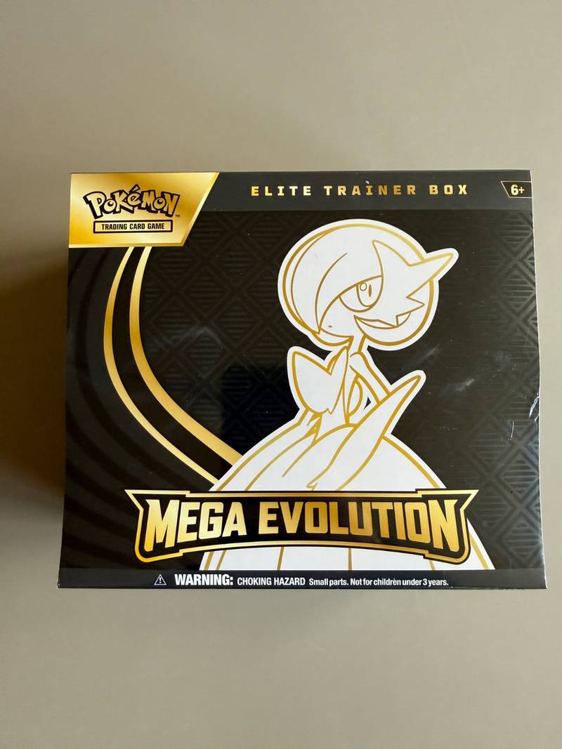 Factory sealed Pokémon TCG Mega Evolution Elite Trainer Box with Mega Gardevoir illustration on black and gold packaging. - view 1