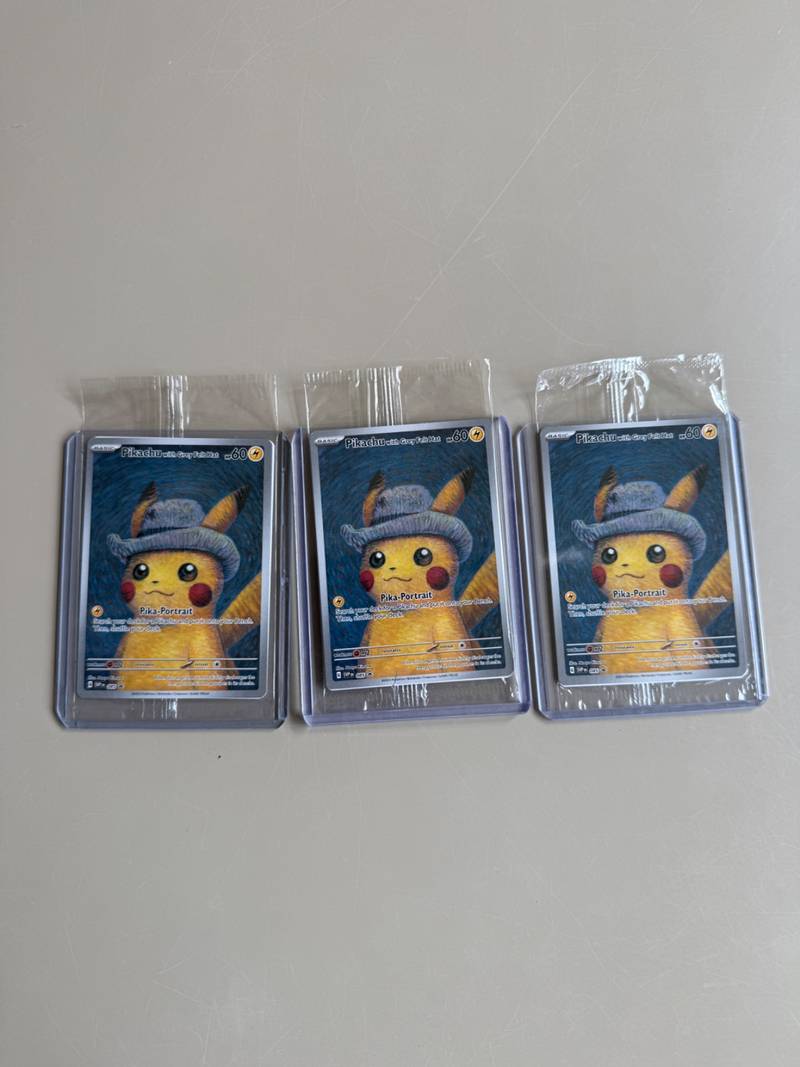 Three sealed Pokémon Pikachu with Grey Felt Hat promo cards in top loaders showing front artwork and back barcode labels. - view 1