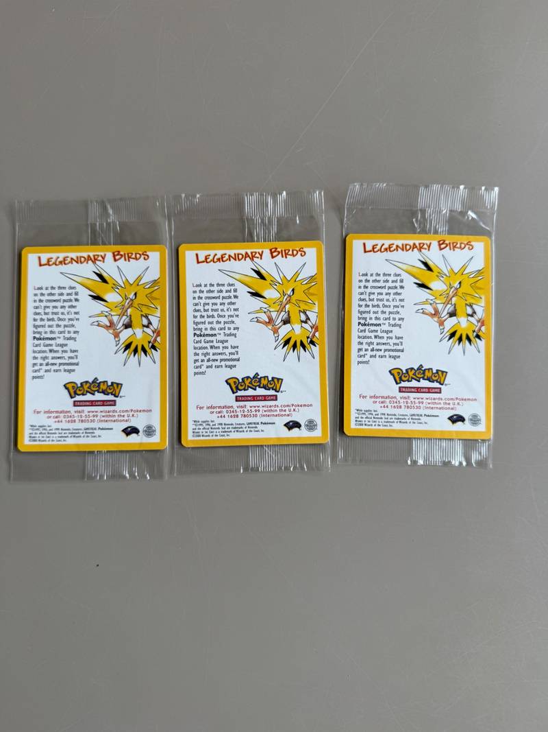 Three sealed vintage 2000 Wizards of the Coast Pokémon Legendary Birds promotional cellophane packs - view 1