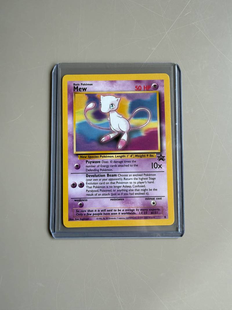Vintage Wizards of the Coast Pokémon promo card featuring Mew numbered 8 in a protective top loader - view 1