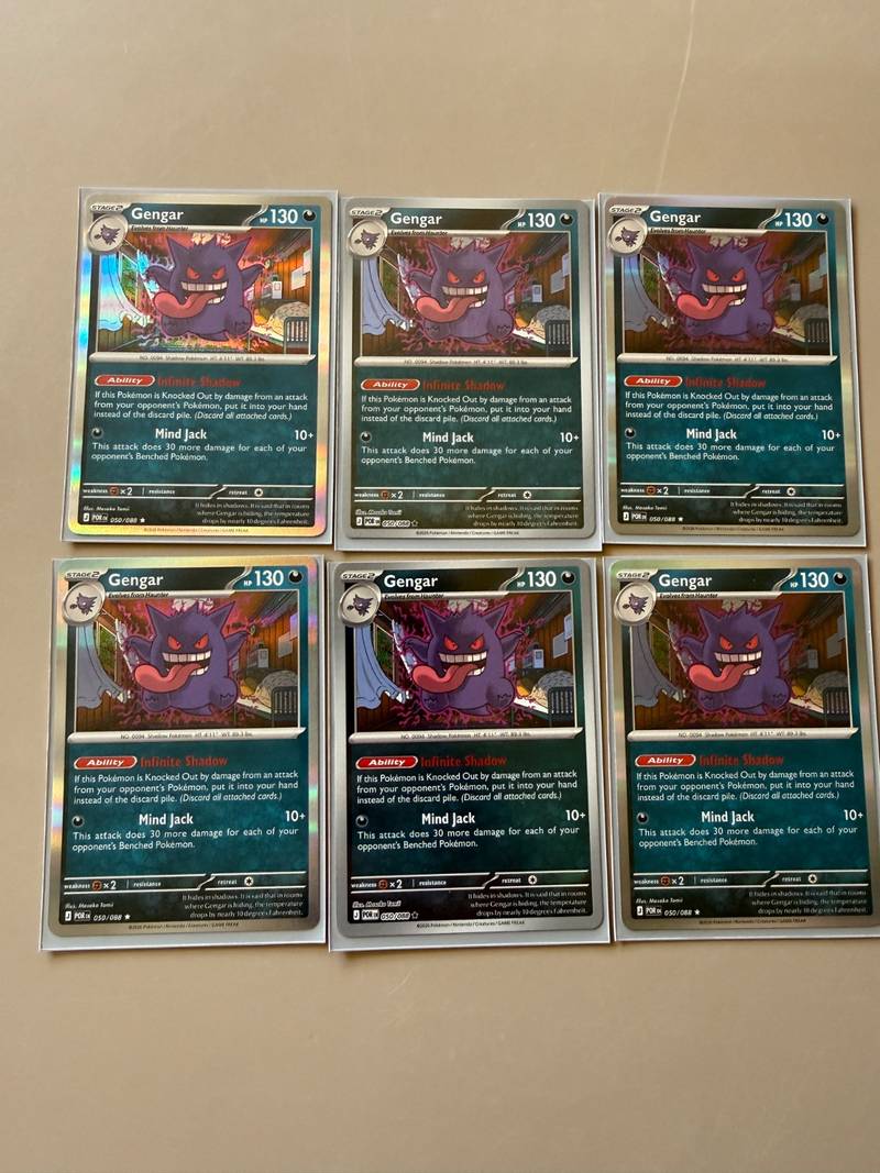 Six English Gengar cards from Pokemon Perfect Order laid out in sleeves - view 1